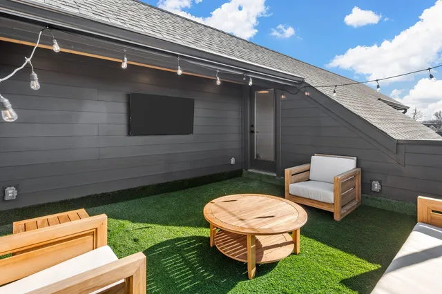 a view of a backyard with sitting area
