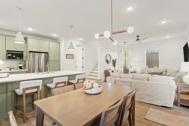 a large kitchen with a table and chairs
