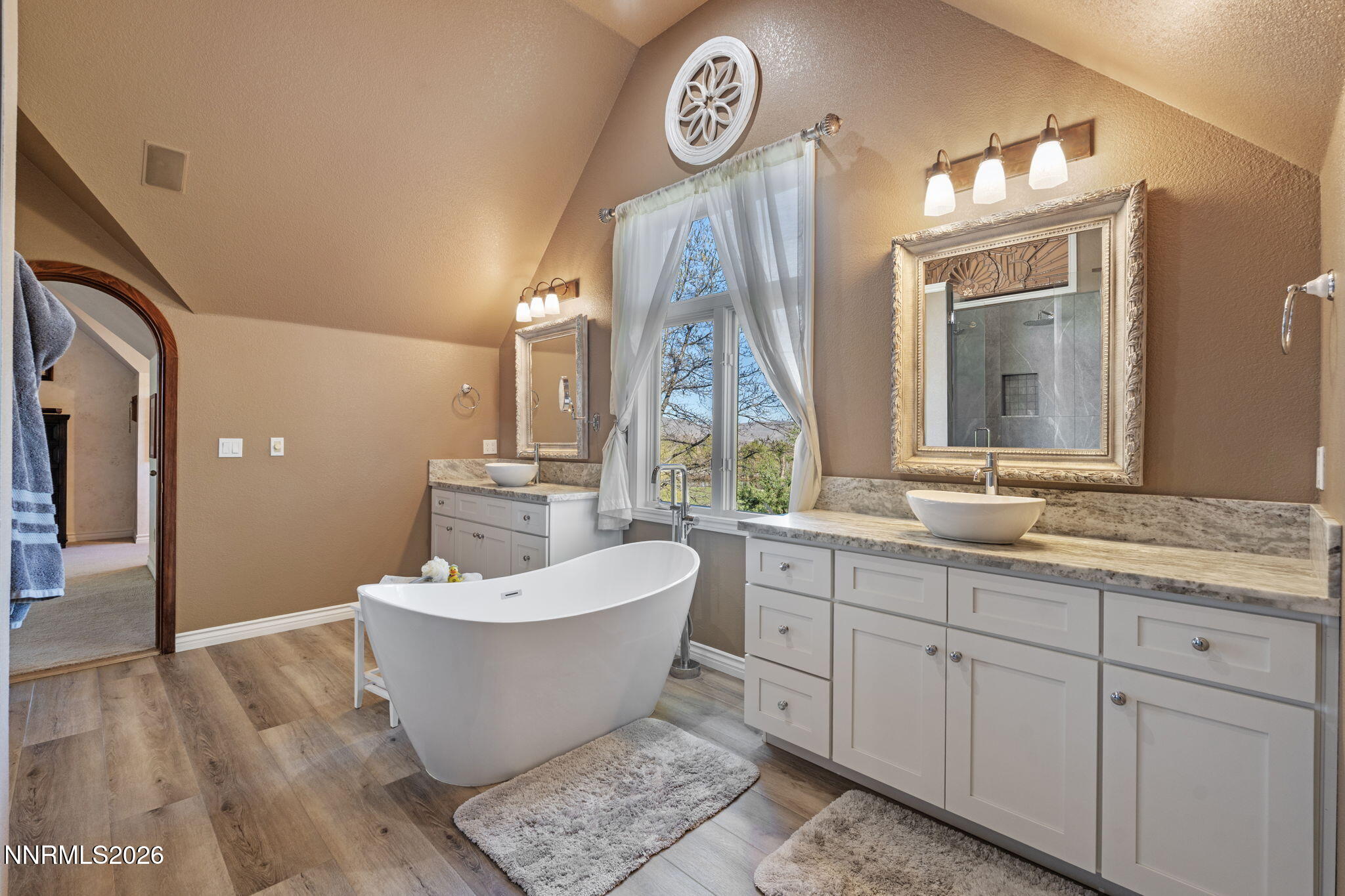 7850 Kevin Circle Reno, NV 89511 - Photo 23 of 68 a spacious bathroom with a granite countertop sink and a mirror