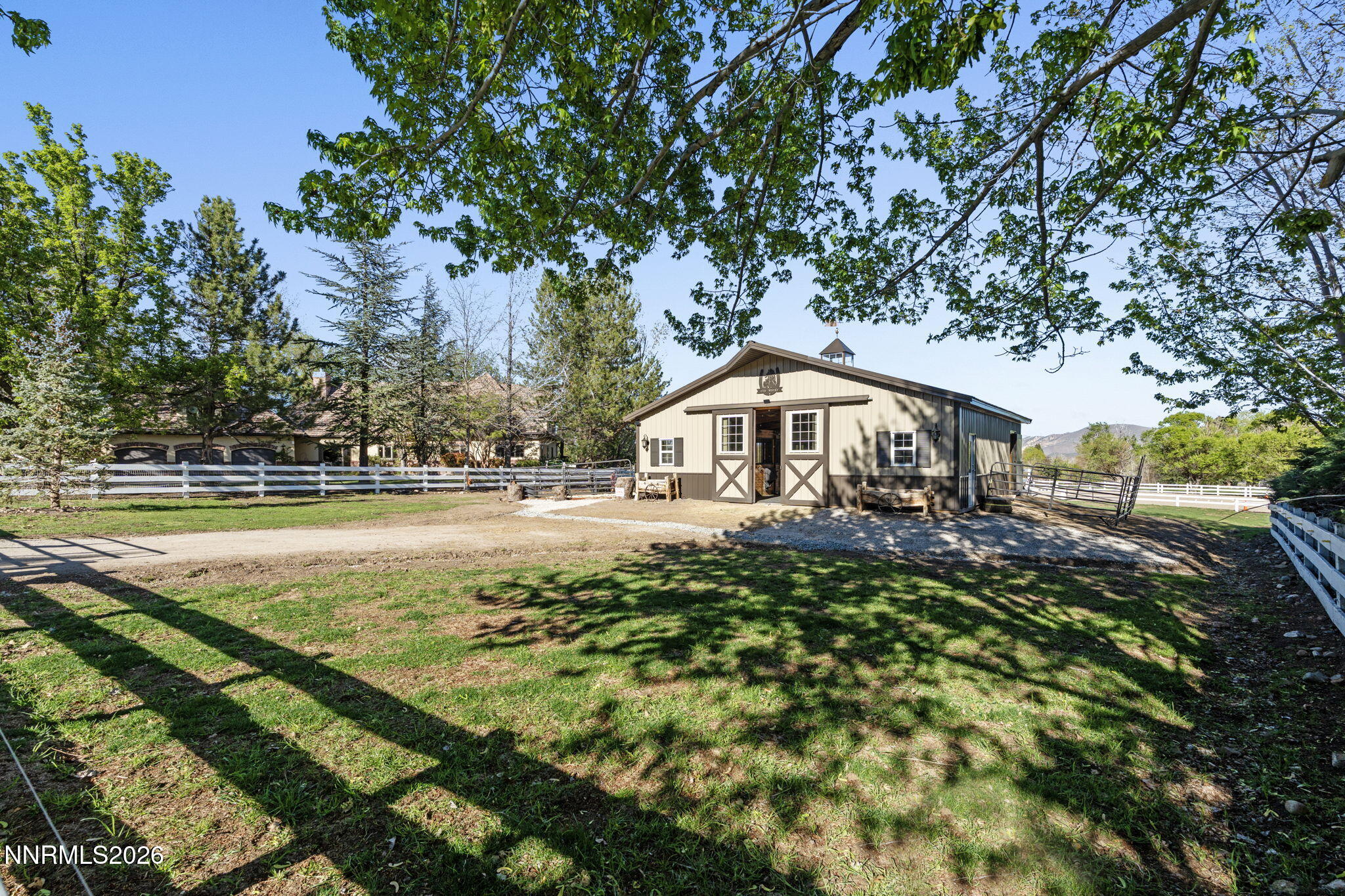 7850 Kevin Circle Reno, NV 89511 - Photo 46 of 68 a view of swimming pool with lawn chairs and wooden fence