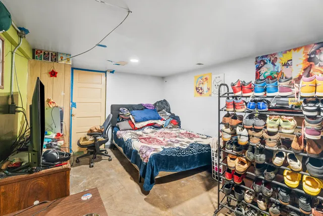 a bedroom with bed and a window