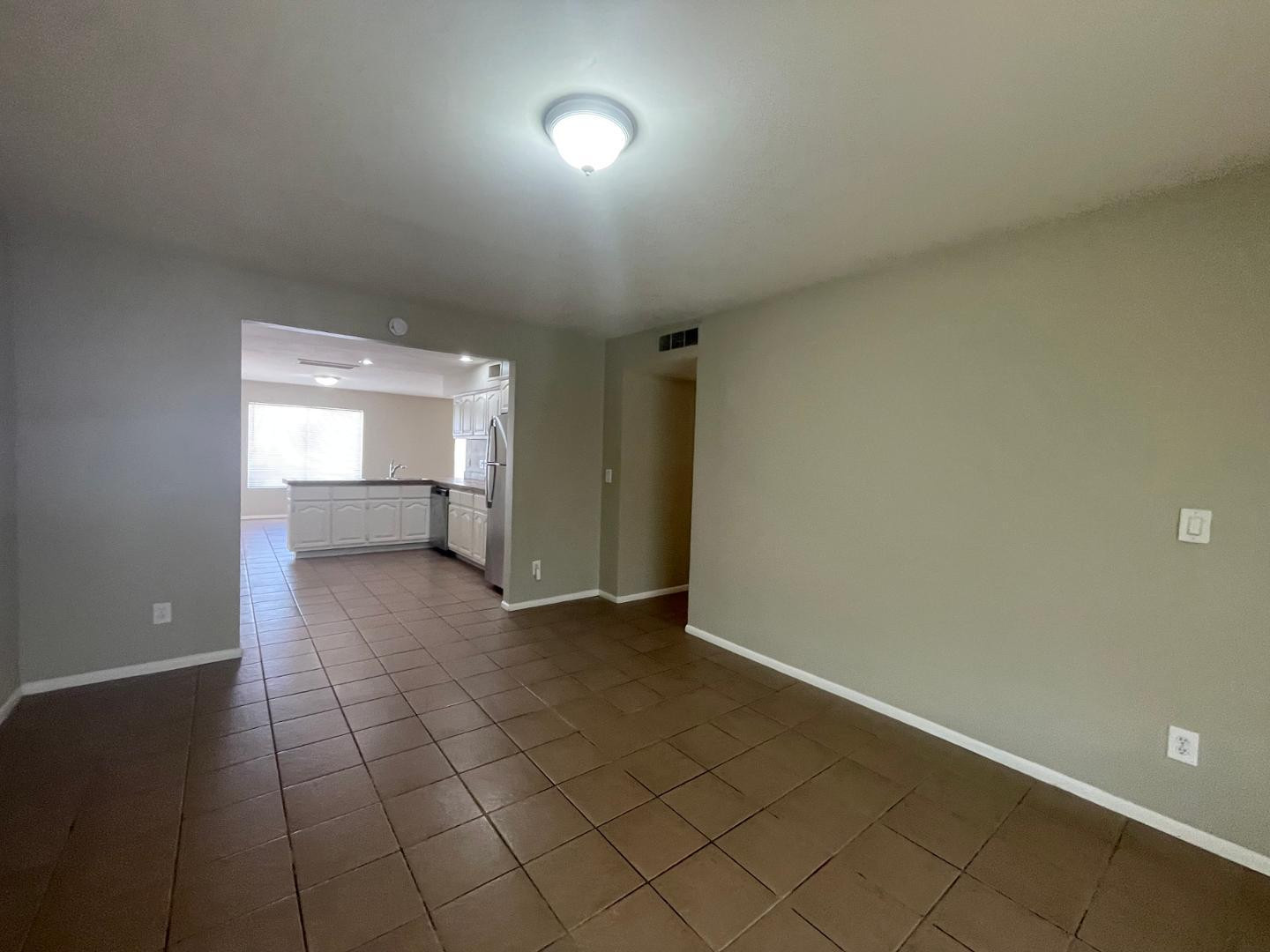 10902 West Montecito Avenue Phoenix, AZ 85037 - Photo 5 of 22 a view of an empty room and window