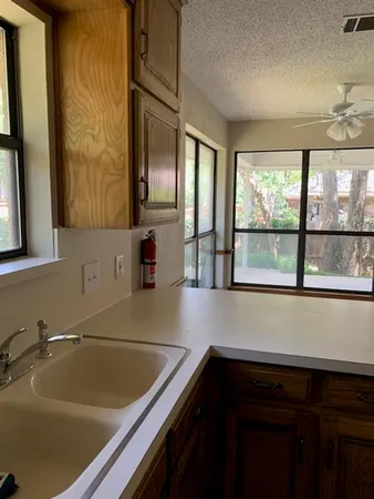 a bathroom with a sink and a large mirror