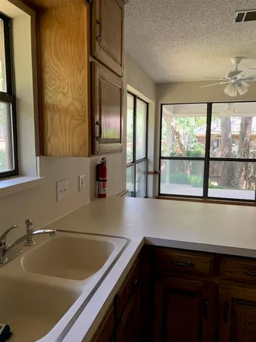 a bathroom with a sink and a large mirror