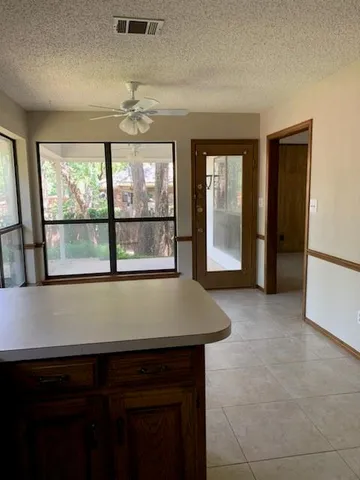 a view of a kitchen with a sink and dishwasher