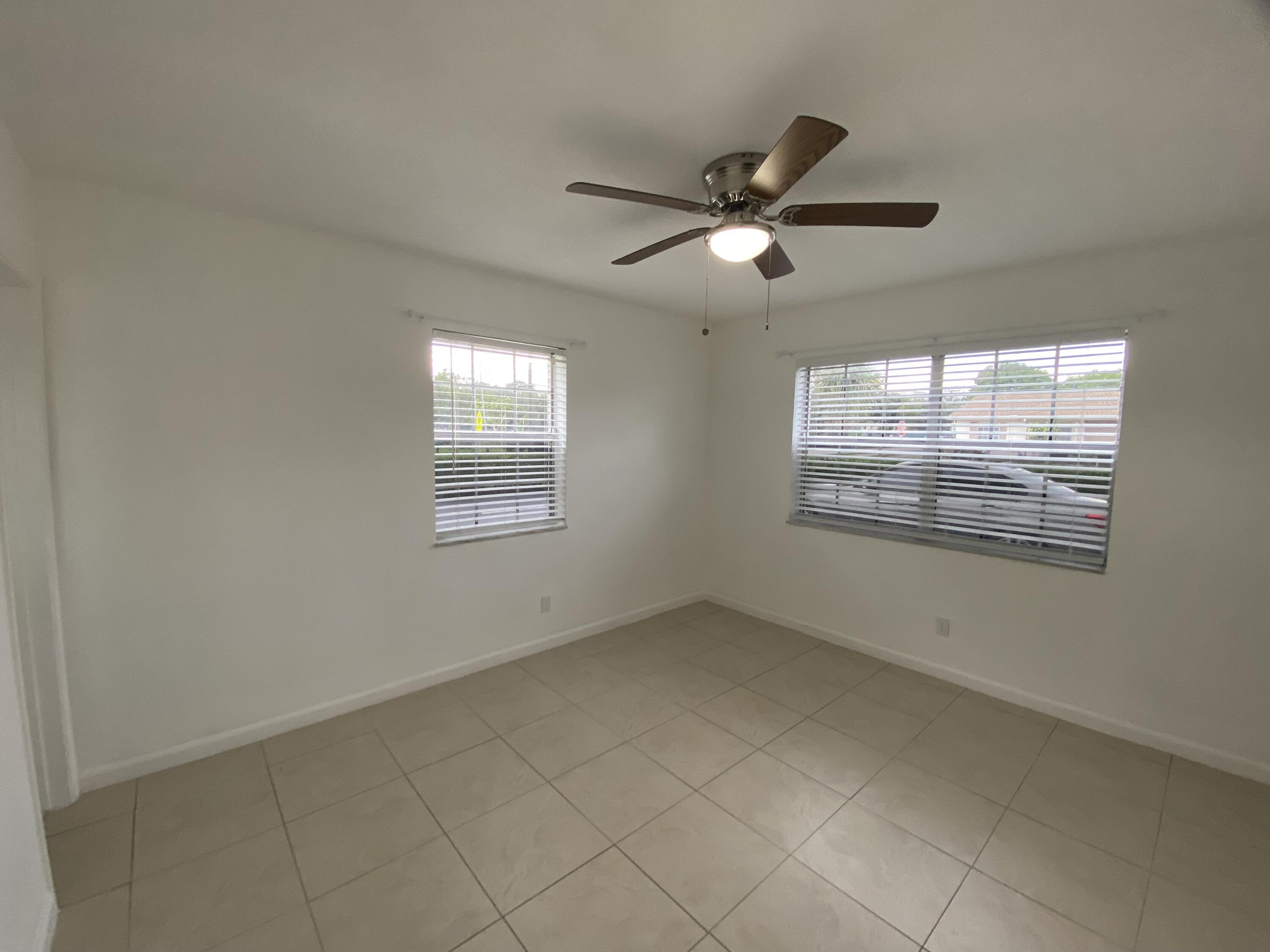 298 Southwest 6th Street, Unit 109 Boca Raton, FL 33432 - Photo 20 of 28 a view of an empty room with a window