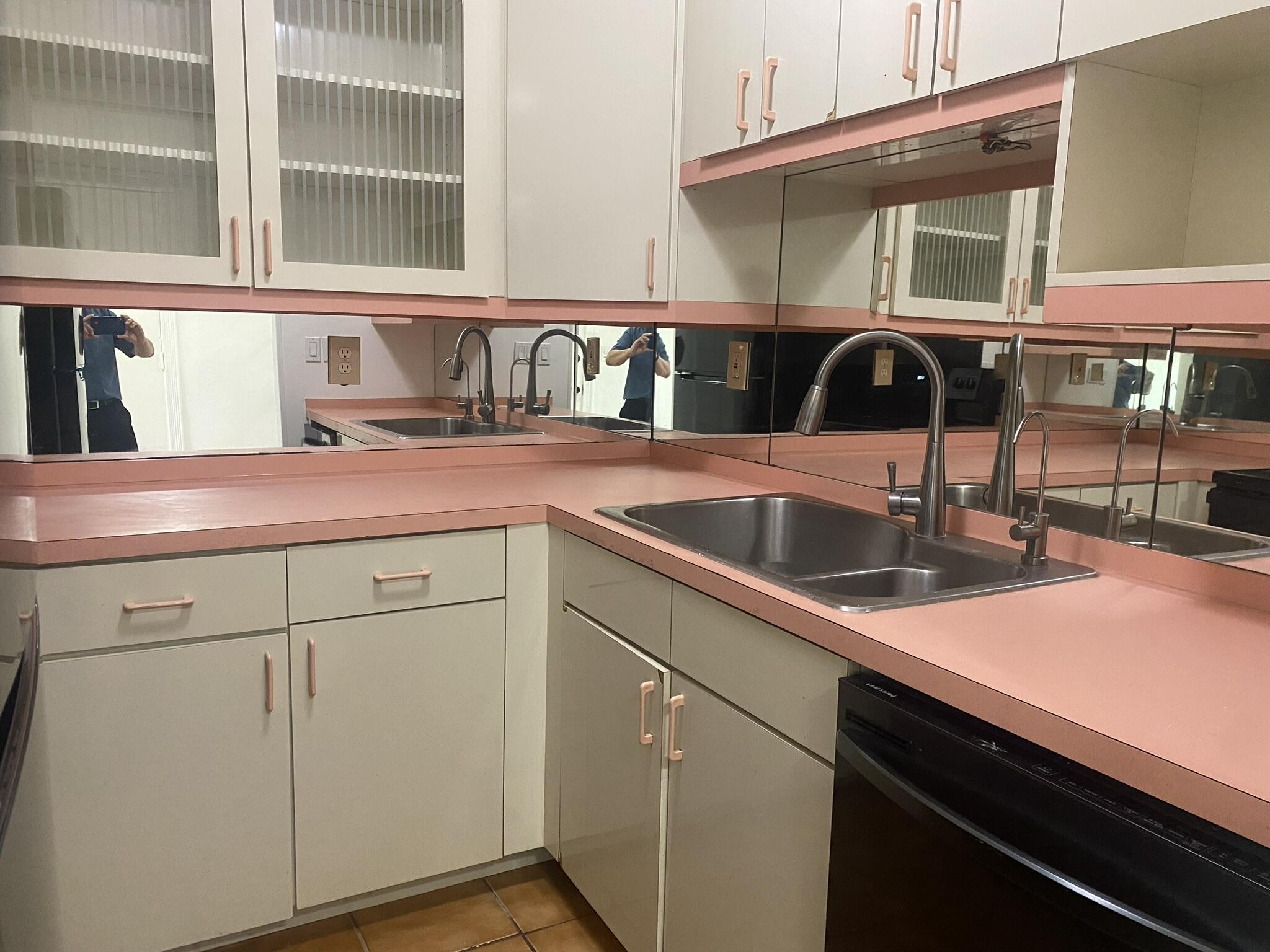 298 Southwest 6th Street, Unit 109 Boca Raton, FL 33432 - Photo 3 of 28 a kitchen with a sink and cabinets