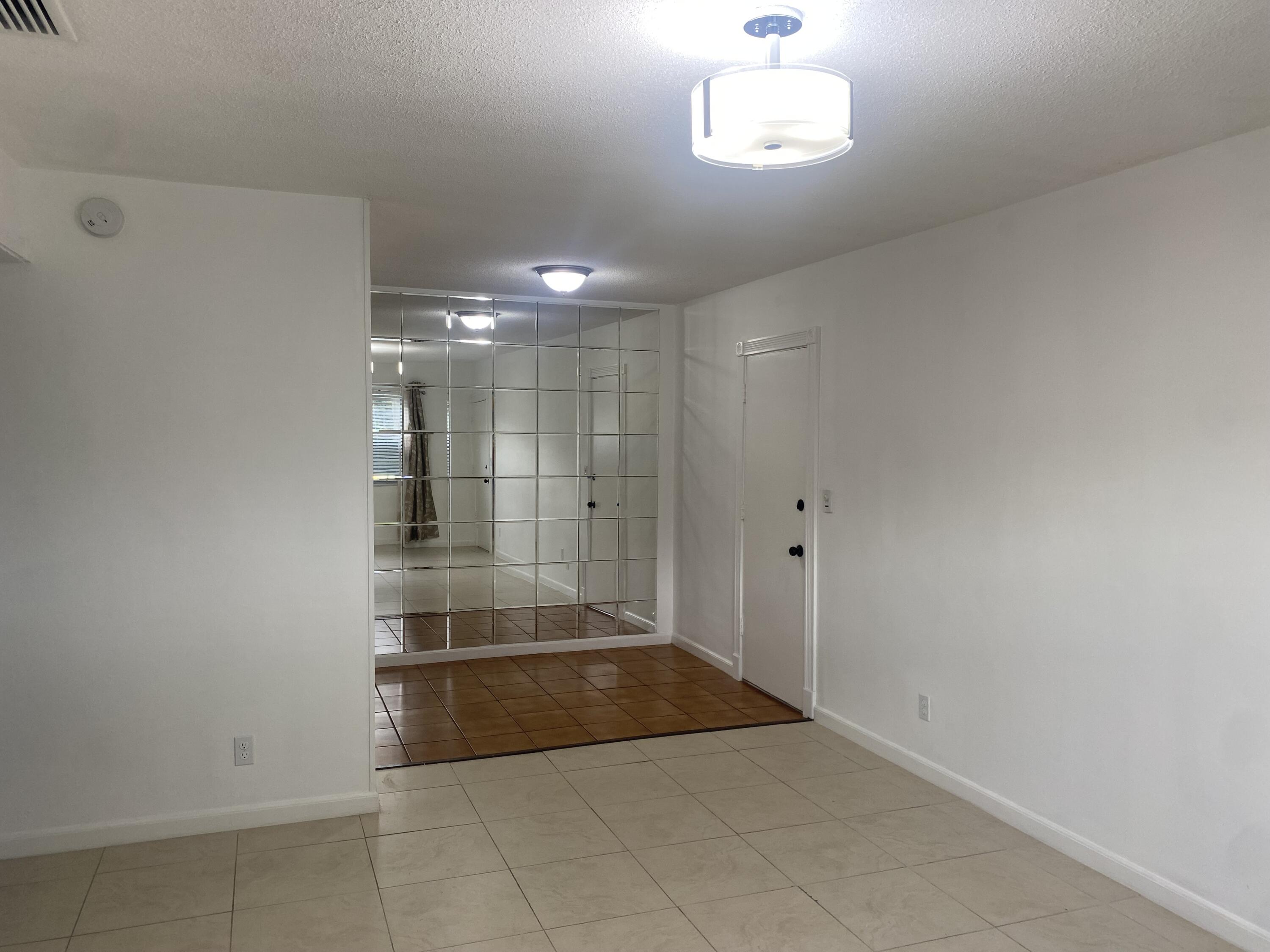 298 Southwest 6th Street, Unit 109 Boca Raton, FL 33432 - Photo 7 of 28 a view of an empty room