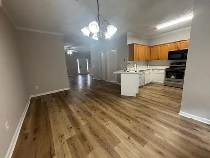 a view of living room kitchen and kitchen