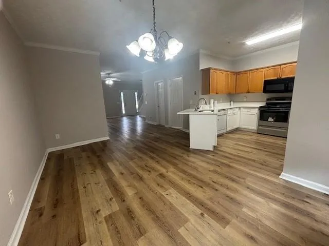 a view of living room kitchen and kitchen