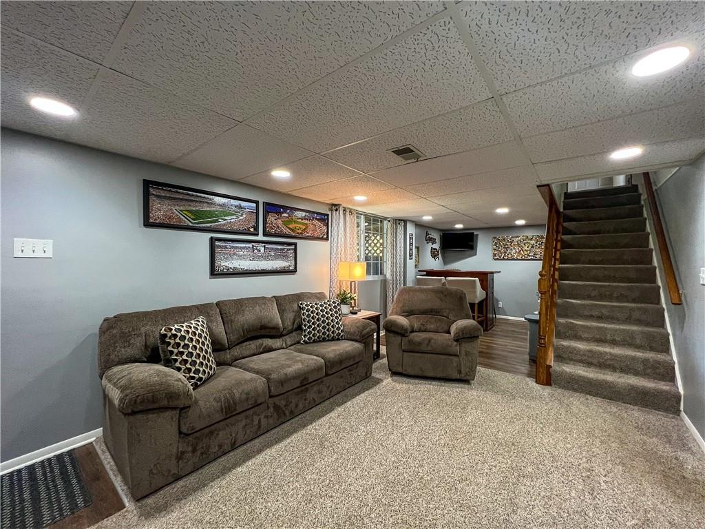139 Delaware Drive Butler, PA 16001 - Photo 14 of 27 a living room with furniture and stairs