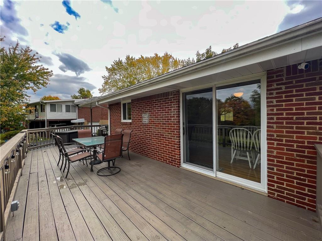 139 Delaware Drive Butler, PA 16001 - Photo 21 of 27 a backyard of a house with table and chairs