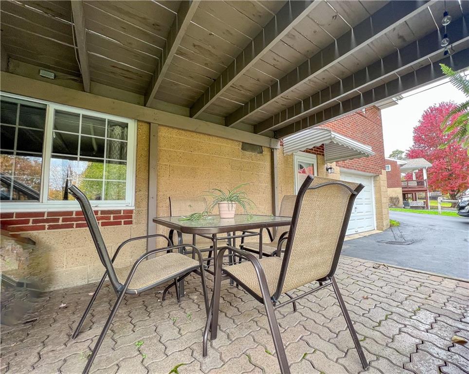 139 Delaware Drive Butler, PA 16001 - Photo 23 of 27 a patio with a table and chairs