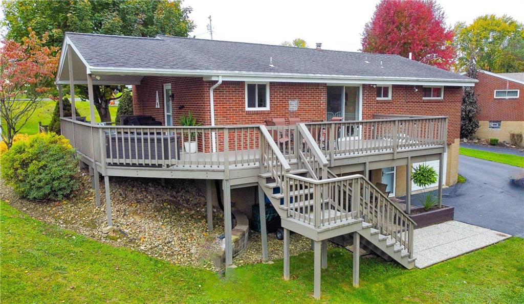 139 Delaware Drive Butler, PA 16001 - Photo 27 of 27 a view of a house with a wooden deck and a yard