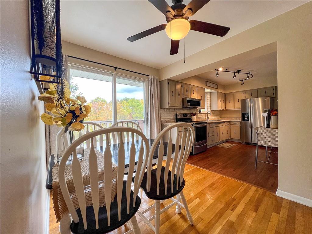 139 Delaware Drive Butler, PA 16001 - Photo 5 of 27 a view of a livingroom with furniture a ceiling fan and front door