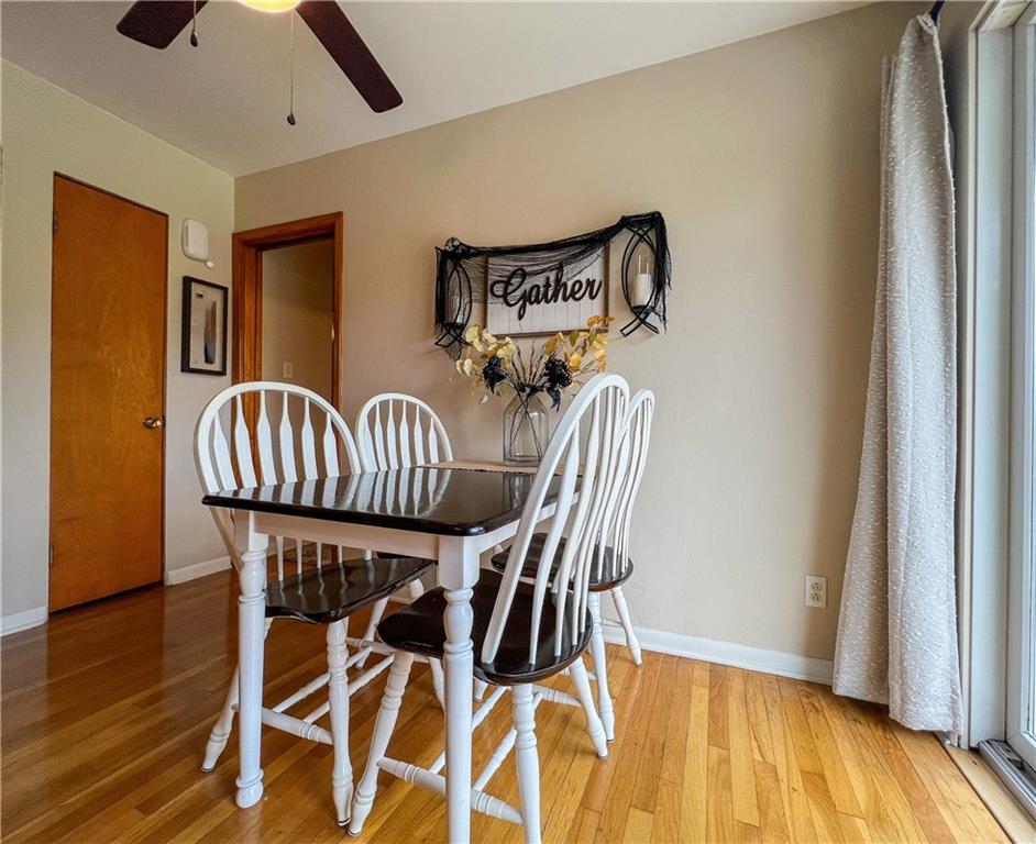 139 Delaware Drive Butler, PA 16001 - Photo 6 of 27 a view of a dining room with furniture and wooden floor