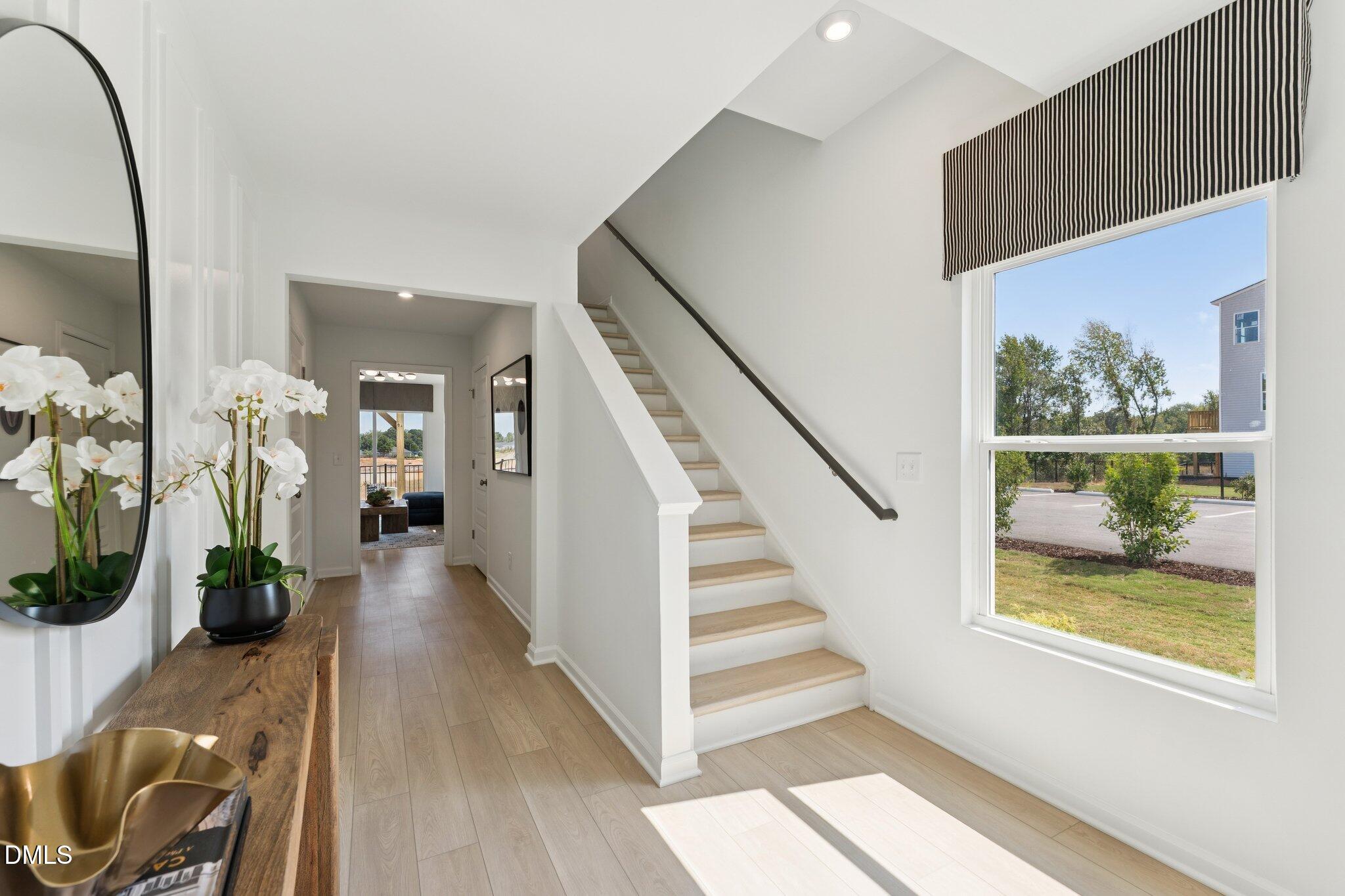 3206 Bomore Road Raleigh, NC 27610 - Photo 4 of 34 a view of entryway and hall with wooden floor
