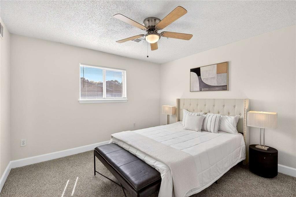377 Ralph McGill Boulevard Northeast, Unit N Atlanta, GA 30312 - Photo 19 of 41 a bedroom with a bed and window