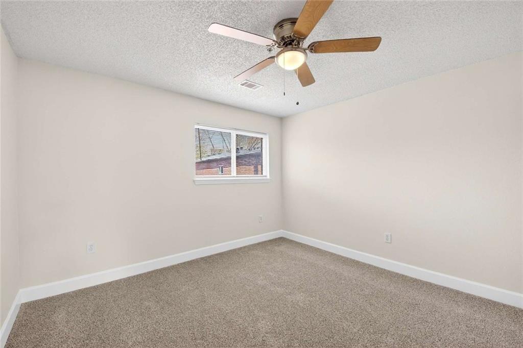 377 Ralph McGill Boulevard Northeast, Unit N Atlanta, GA 30312 - Photo 25 of 41 an empty room with a window