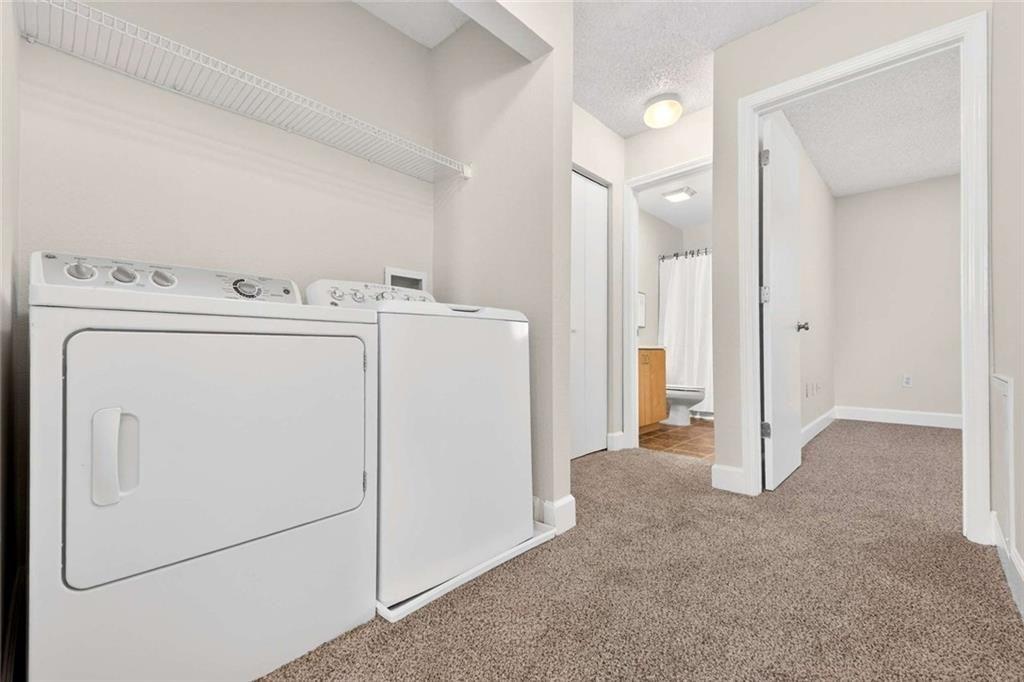377 Ralph McGill Boulevard Northeast, Unit N Atlanta, GA 30312 - Photo 28 of 41 a view of a storage & utility room with dryer and washer