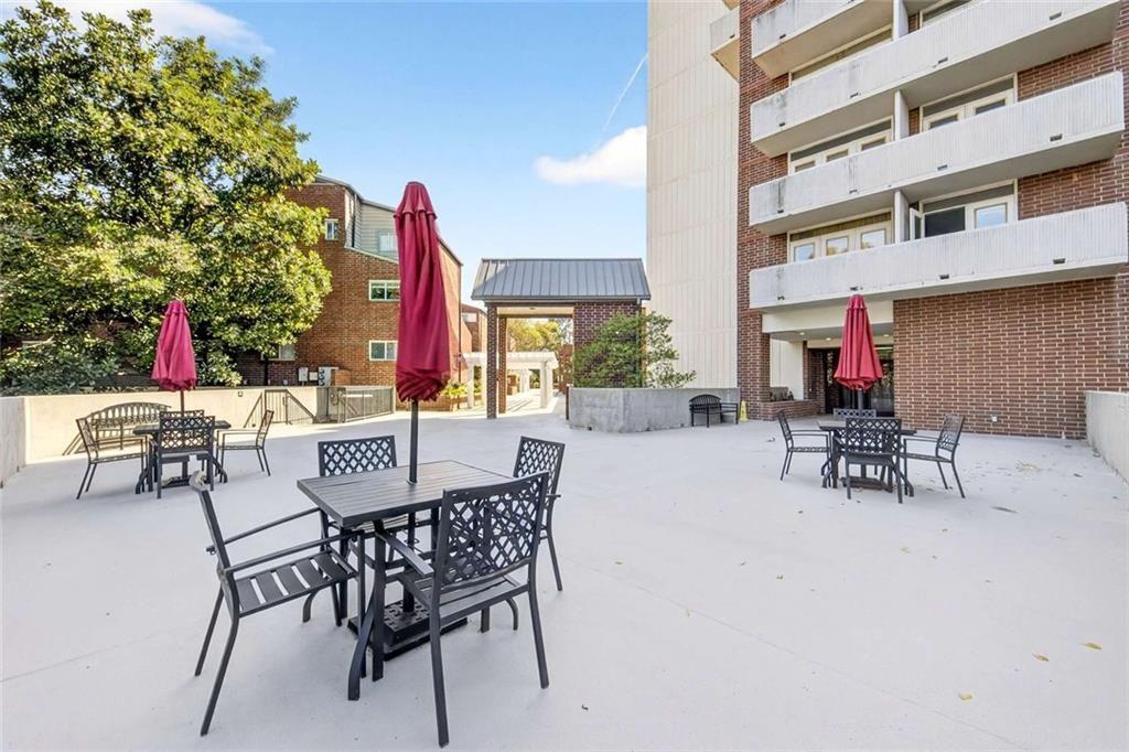 377 Ralph McGill Boulevard Northeast, Unit N Atlanta, GA 30312 - Photo 38 of 41 a view of a dinning tables and chairs in the patio