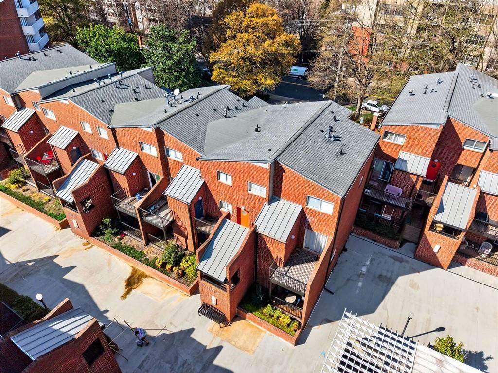 377 Ralph McGill Boulevard Northeast, Unit N Atlanta, GA 30312 - Photo 40 of 41 an aerial view of a residential apartment building with a yard