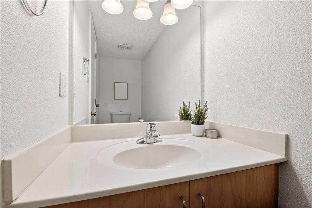 377 Ralph McGill Boulevard Northeast, Unit N Atlanta, GA 30312 - Photo 7 of 41 a bathroom with a sink and a mirror