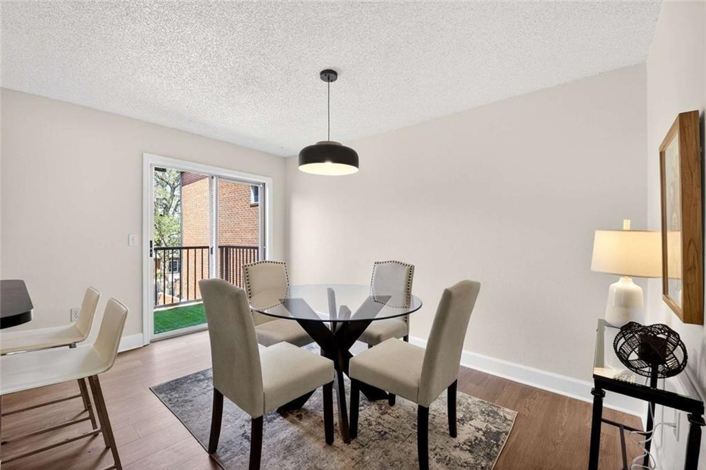 377 Ralph McGill Boulevard Northeast, Unit N Atlanta, GA 30312 - Photo 8 of 41 a dining room with furniture and window