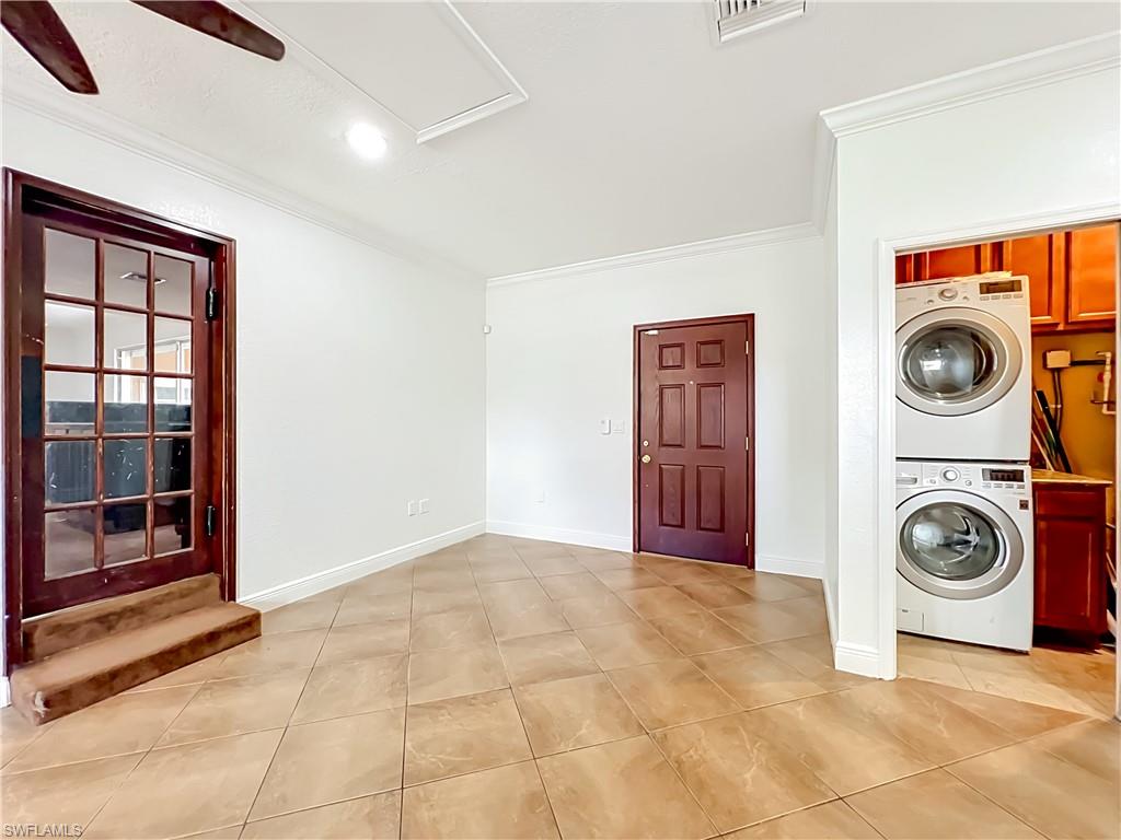4210 South Hiawassee Road Orlando, FL 32835 - Photo 19 of 49 a view of a storage & utility room with washer and dryer