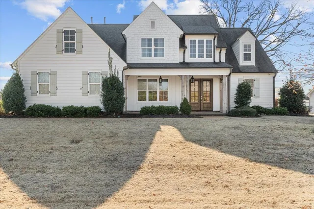 a front view of a house with a yard
