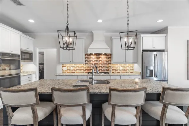 a view of a dining room with furniture large window and wooden floor