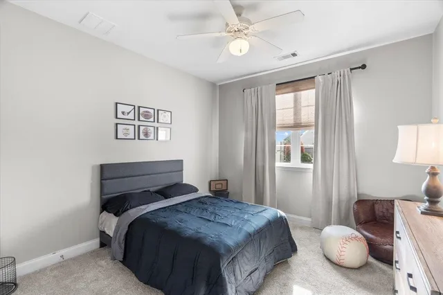 a bedroom with a bed and window