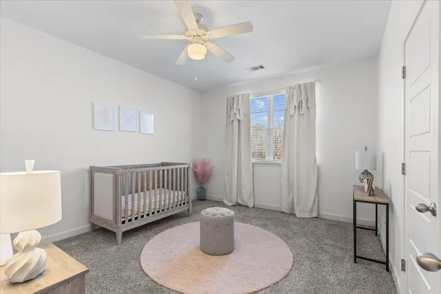 a bedroom with furniture and a window