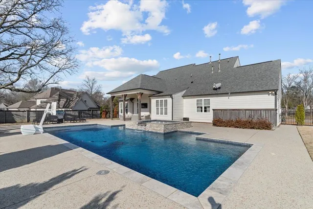 a view of a patio with swimming pool