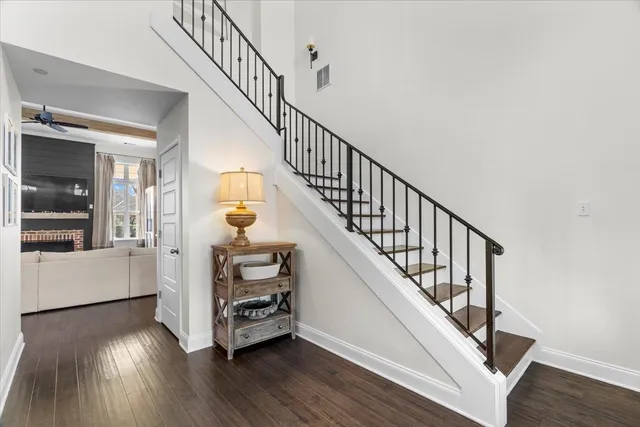 a view of staircase with wooden floor and a window