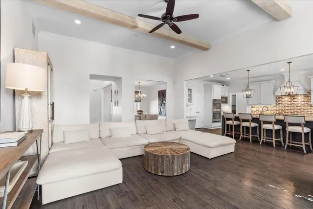a living room with fireplace furniture and a wooden floor