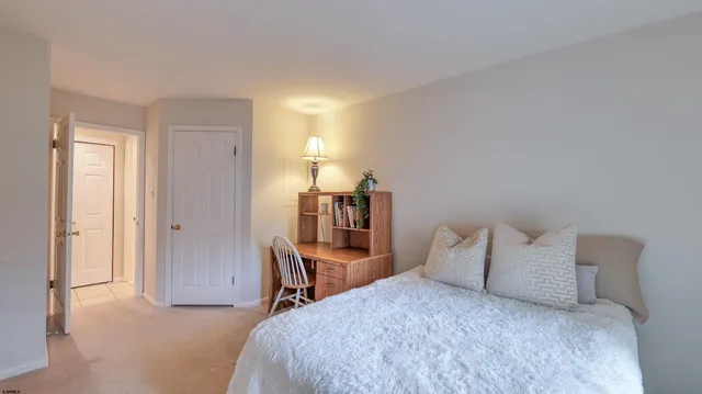 a bed room with a bed and a chair