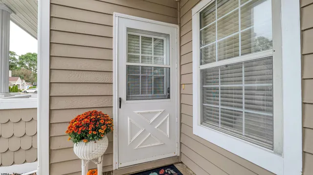 a view of a door and a window