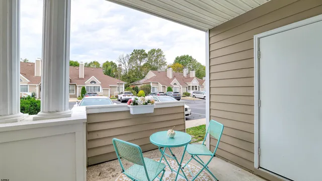 a dining room with furniture and a window