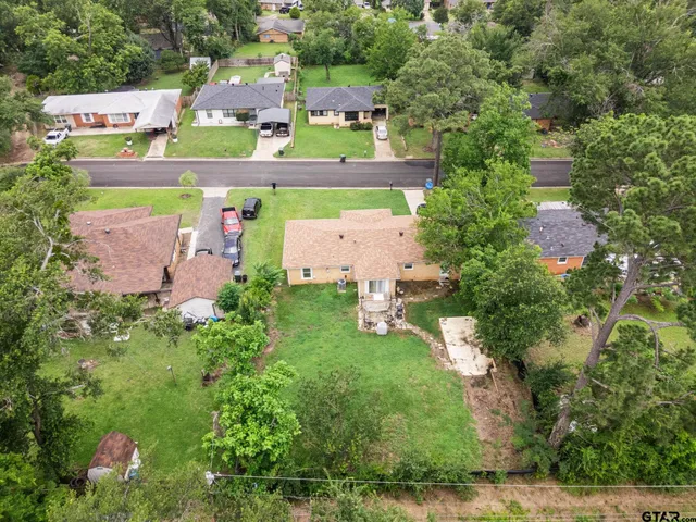 an aerial view of a house with a garden