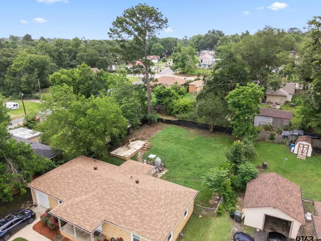 an aerial view of a house having yard