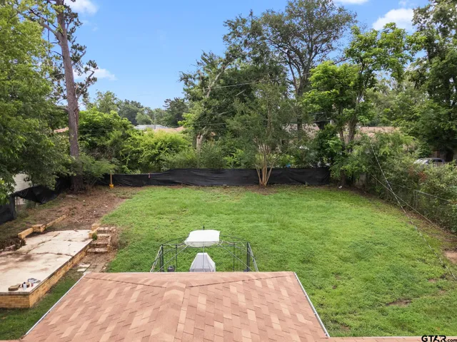 a view of a backyard with a garden
