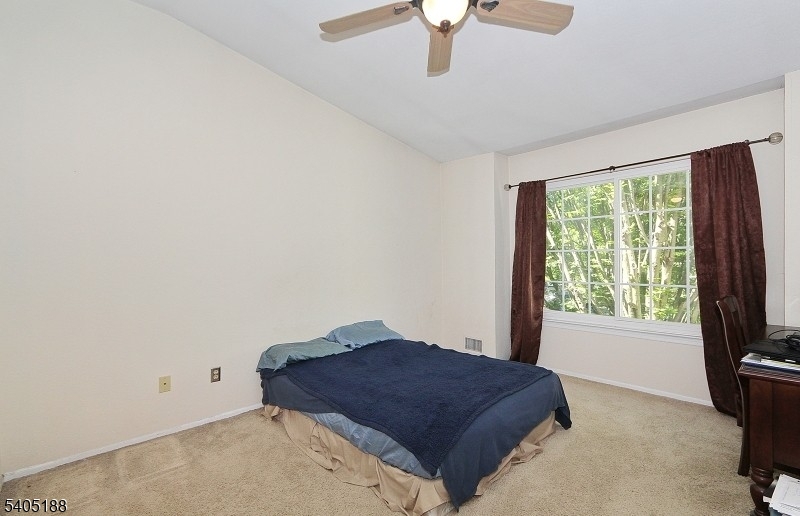 58 Wescott Road Bedminster, NJ 07921 - Photo 9 of 13 a bedroom with a bed and a window