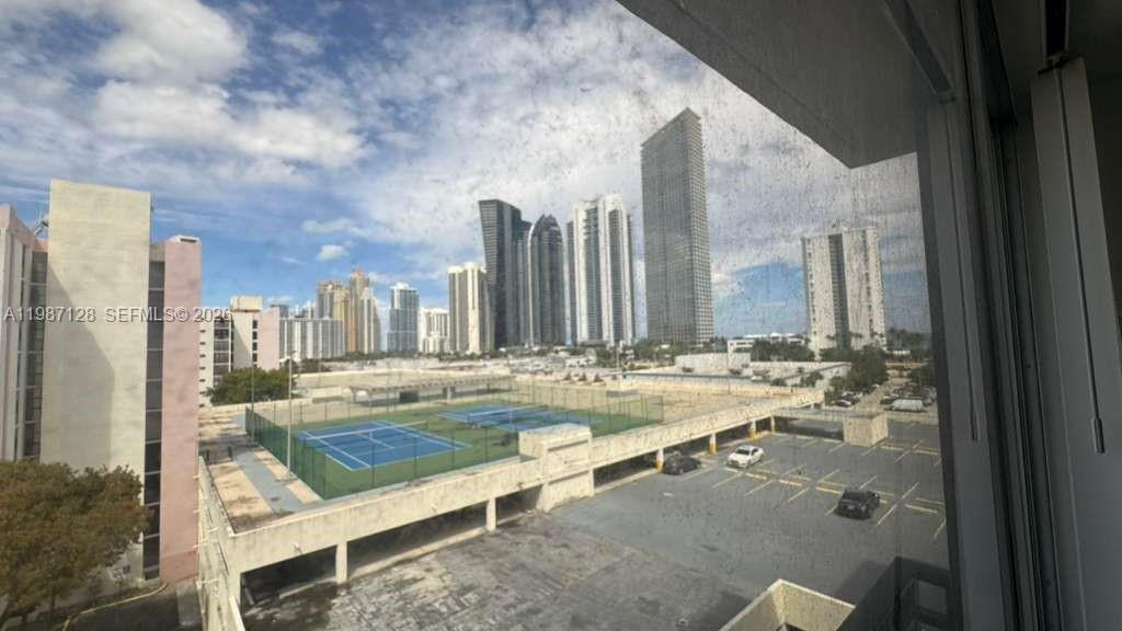 16909 North Bay Road, Unit 710 Sunny Isles Beach, FL 33160 - Photo 19 of 19 a view of a swimming pool with outdoor seating and plants