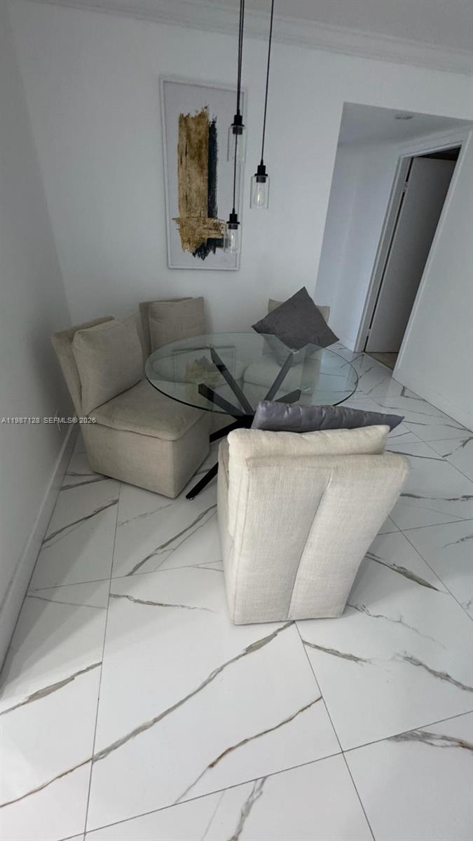 16909 North Bay Road, Unit 710 Sunny Isles Beach, FL 33160 - Photo 9 of 19 a living room with furniture