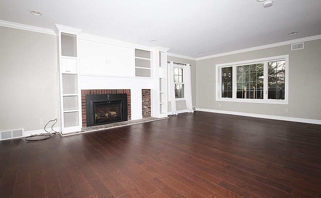 764 Osage Road Mt. Lebanon, PA 15243 - Photo 2 of 24 This Living room offers a gas log fireplace and built in book shelves. Crown molding and hardwood floors and recessed lighting. A light and bright room with an open floor plan.