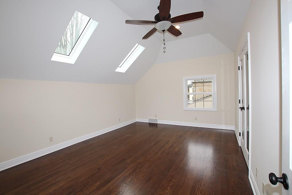 764 Osage Road Mt. Lebanon, PA 15243 - Photo 11 of 24 Master bedroom with sky lights , hardwood floors, paddle fan with a light and a walk in closet.
