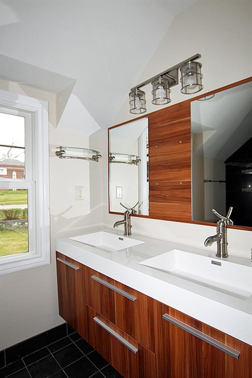 764 Osage Road Mt. Lebanon, PA 15243 - Photo 15 of 24 Hall bath with wood cabinetry and built in mirrors.
