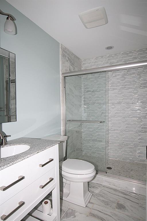 764 Osage Road Mt. Lebanon, PA 15243 - Photo 17 of 24 First floor full bath with a step in shower, built in vanity.