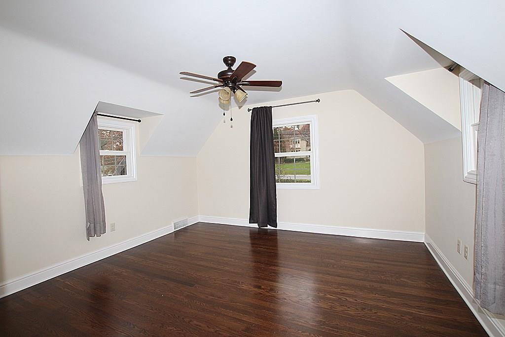 764 Osage Road Mt. Lebanon, PA 15243 - Photo 18 of 24 4th bedroom with hardwood floors and a paddle fan light.